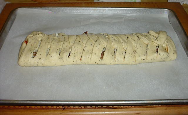 Unbaked Filled Pizza Bread image